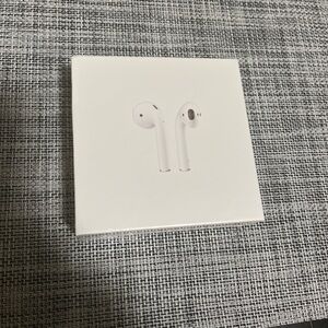 Apple AirPods 2nd Gen sealed in the original box and comes with a charger.